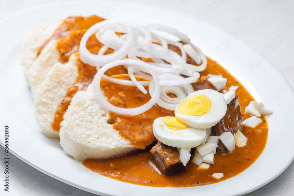 beef goulash with onion rings, boiled egg and dumplings beef goulash with onion rings, boiled egg and dumplings