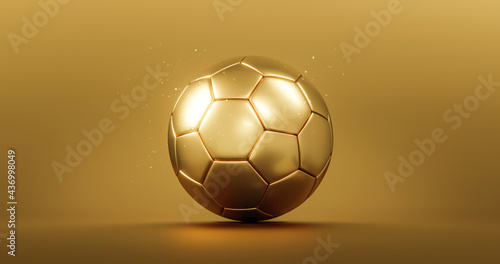 Fototapeta Gold soccer ball or golden football champion award on competition background with winner trophy championship