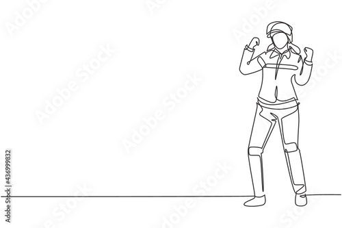 Single continuous line drawing female firefighter stood with celebrate gesture, wearing helmet and uniform work to extinguish fire at building. Dynamic one line draw graphic design vector illustration