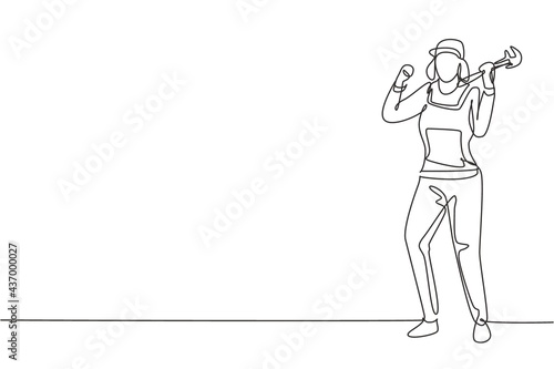 Single one line drawing female plumber stands with celebrate gesture and holding carpentry tool fixing broken plumbing at home. Successful job. Continuous line draw design graphic vector illustration