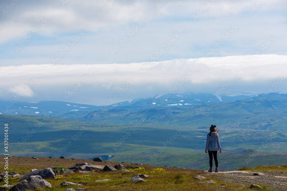 Asian woman travel enjoy season of summer in nature at Iceland, concept relax in nature