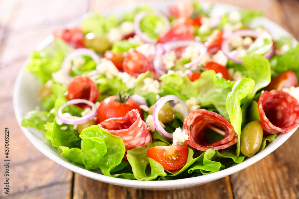 vegetable salad with salami, tomato and cheese vegetable salad with salami, tomato and cheese