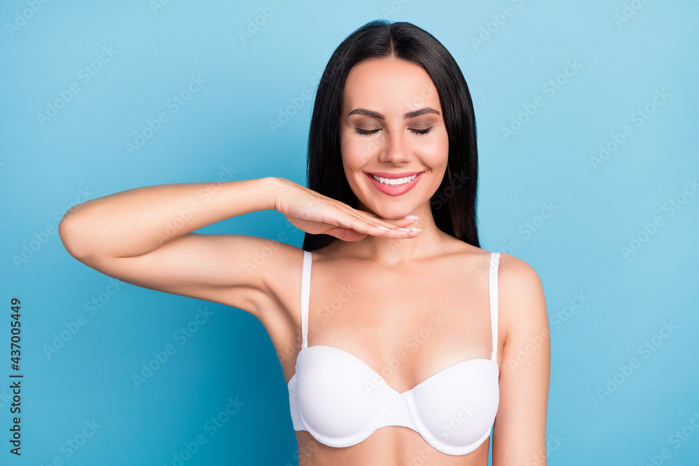 Obraz premium Photo of pretty cheerful lady closed eyes arm under chin facial correction isolated on blue color background
