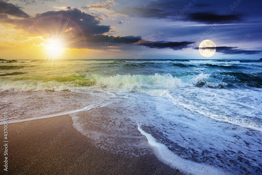 day and night time change concept above sea tide on a cloudy twilight. green waves crashing golden sandy beach with sun and moon above the horizon. storm weather approaching. summer holiday concept