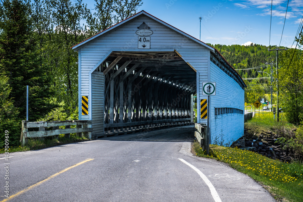 Anse St Jean covered bridge is spanning over the Matapedia river near Amqui in Quebec, Canada Anse St Jean covered bridge is spanning over the Matapedia river near Amqui in Quebec, Canada