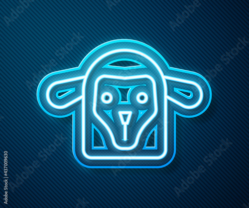Glowing neon line Sheep head icon isolated on blue background. Animal symbol. Vector