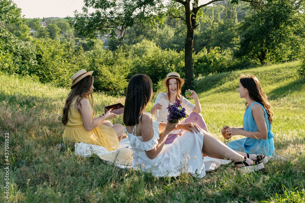 Summer Party Ideas. Safe and Festive Ways to Host Small, Outdoor Gathering with friends. People safely get together. Young women girl friends talking, laughing, having fun together at picnic Summer Party Ideas. Safe and Festive Ways to Host Small, Outdoor Gathering with friends. People safely get together. Young women girl friends talking, laughing, having fun together at picnic