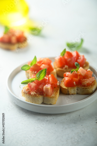 Traditional homemade bruschetta with tomato and basil 