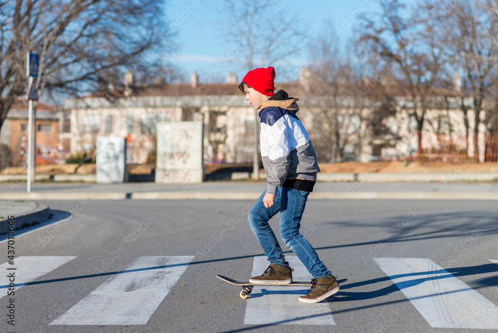 Teenager skateboarder boy with a skateboard on asphalt playground doing tricks. Teenager skateboarder boy with a skateboard on asphalt playground doing tricks.
