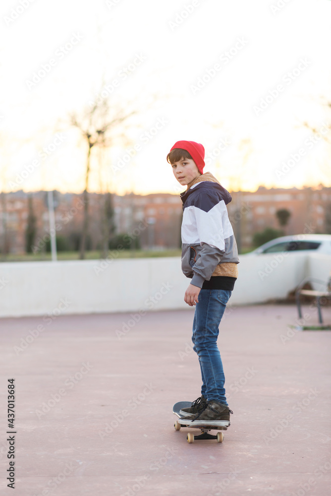 Teenager skateboarder boy with a skateboard on asphalt playground doing tricks. Teenager skateboarder boy with a skateboard on asphalt playground doing tricks.