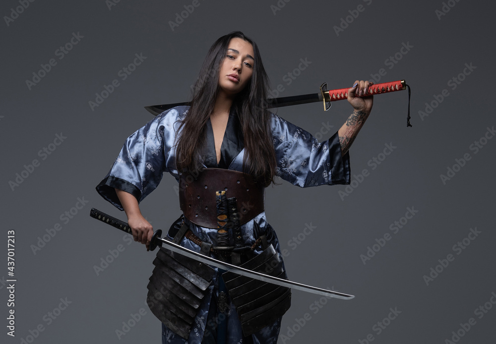 Dangerous woman samurai posing with samurai swords Stock Photo Adobe