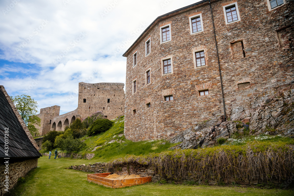 Gothic medieval castle Velhartice in sunny day, tower and stone arch bridge, fortress masonry wall, old stronghold, Velhartice, National Park Sumava, South Bohemia, Czech Republic Gothic medieval castle Velhartice in sunny day, tower and stone arch bridge, fortress masonry wall, old stronghold, Velhartice, National Park Sumava, South Bohemia, Czech Republic
