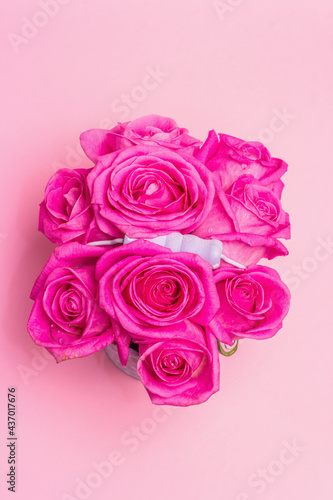 Bouquet of fresh pink roses in a bucket