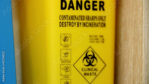 Real yellow tank with warning labels. Clinical waste are hazard for the environment. Footage for ecology disaster and radiation. Reservoir filled with danger toxic waste. Yellow container