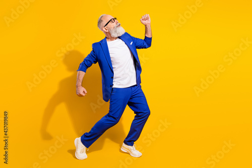 Fototapeta Naklejka Na Ścianę i Meble -  Full length body size view of attractive cheery man dancing having fun good mood isolated over bright yellow color background