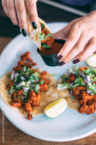 A plate of tacos and tortilla