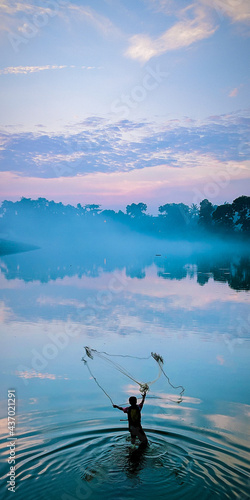fishing in the lake at sunrise