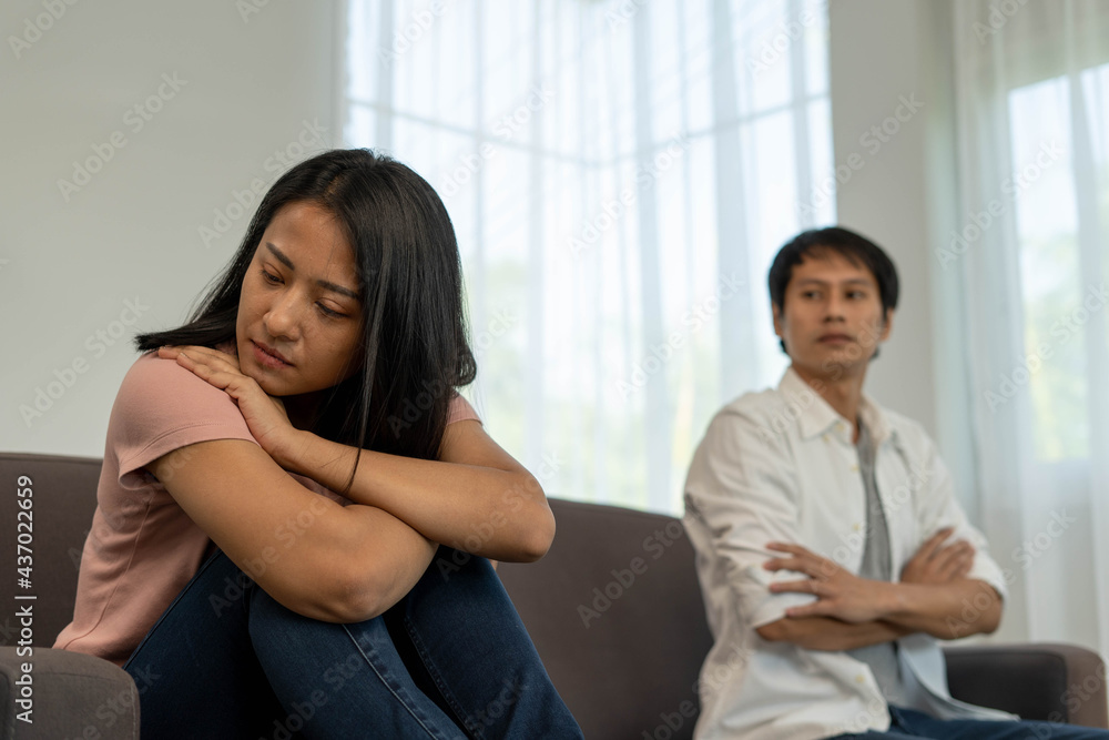 Asian women are disappointed and saddened after an argument with their husband. Asian couples are having family problems resulting in divorce. Love problem Asian women are disappointed and saddened after an argument with their husband. Asian couples are having family problems resulting in divorce. Love problem