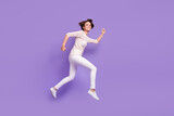 Full body profile portrait of cheerful charming girl running look camera isolated on purple color background