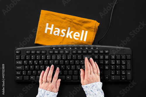 Haskell programming language. Rag width word Haskell and hands on pc keyboard
 photo