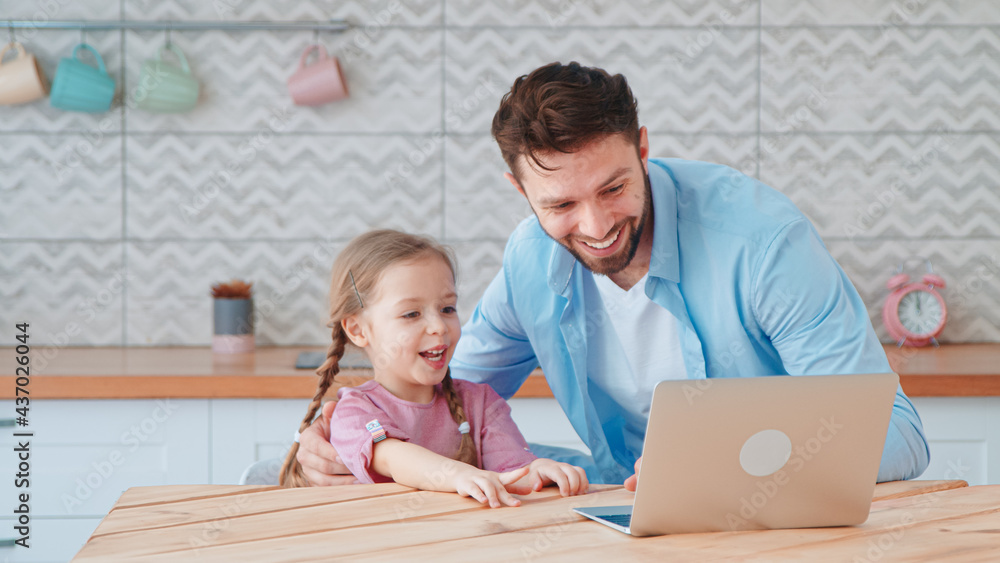 Young dad and little daughter talking on an online conference with mom using a laptop Young dad and little daughter talking on an online conference with mom using a laptop