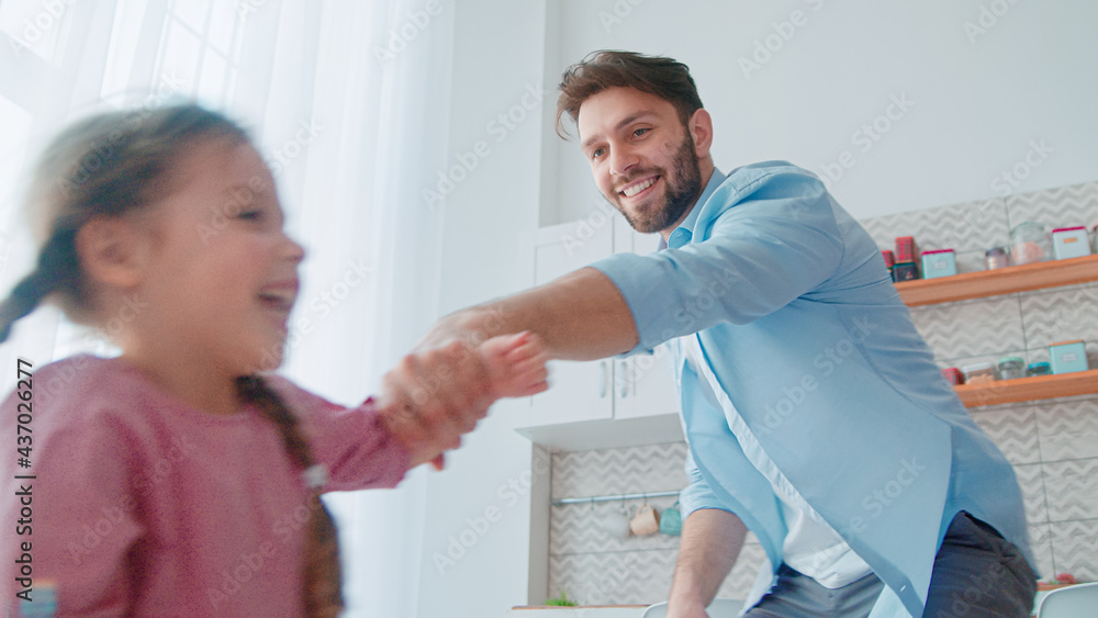 Obraz premium Young family having fun at home