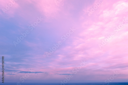 Pink cloudy sky at sunset. Gradient color. Sky texture, abstract nature background © vvvita
