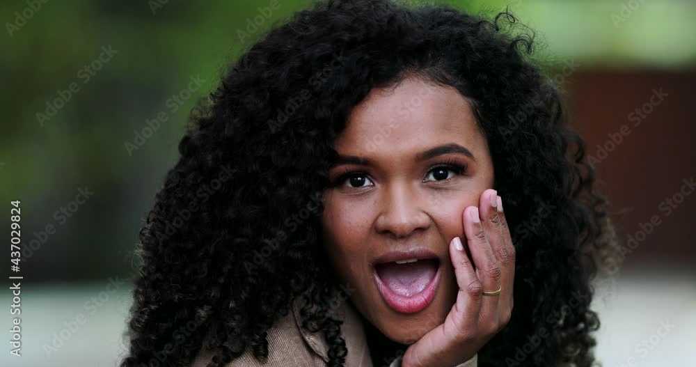 Black girl reacting with surprise and shock, unbelievable news reaction surprise Black girl reacting with surprise and shock, unbelievable news reaction surprise