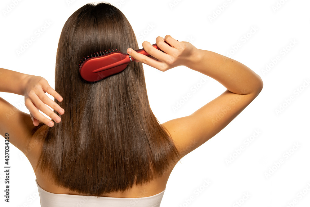 Fototapeta premium woman brushing her hair