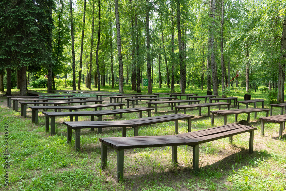 Lonely wooden bench in the park in ummer Lonely wooden bench in the park in ummer