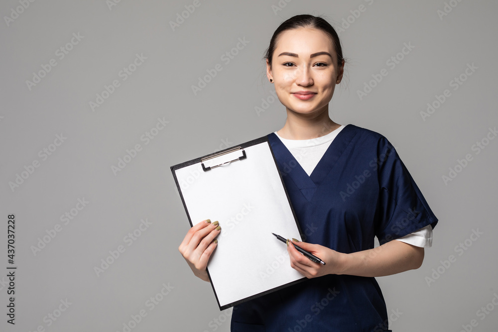 Medical doctor woman showing sign clipboard with copy space for text or design. Female medical professional nurse smiling happy isolated on white background. Medical doctor woman showing sign clipboard with copy space for text or design. Female medical professional nurse smiling happy isolated on white background.
