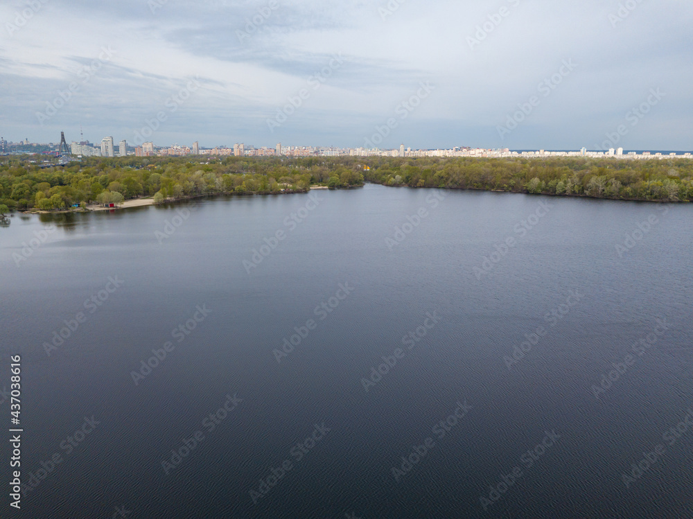 Lake shore in spring. Aerial drone view.
