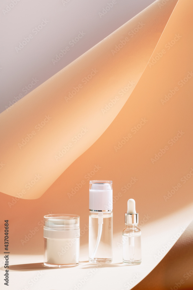 Various cosmetic products in glass jars on beige background. Copy space. Set for skinbeauty products Various cosmetic products in glass jars on beige background. Copy space. Set for skinbeauty products