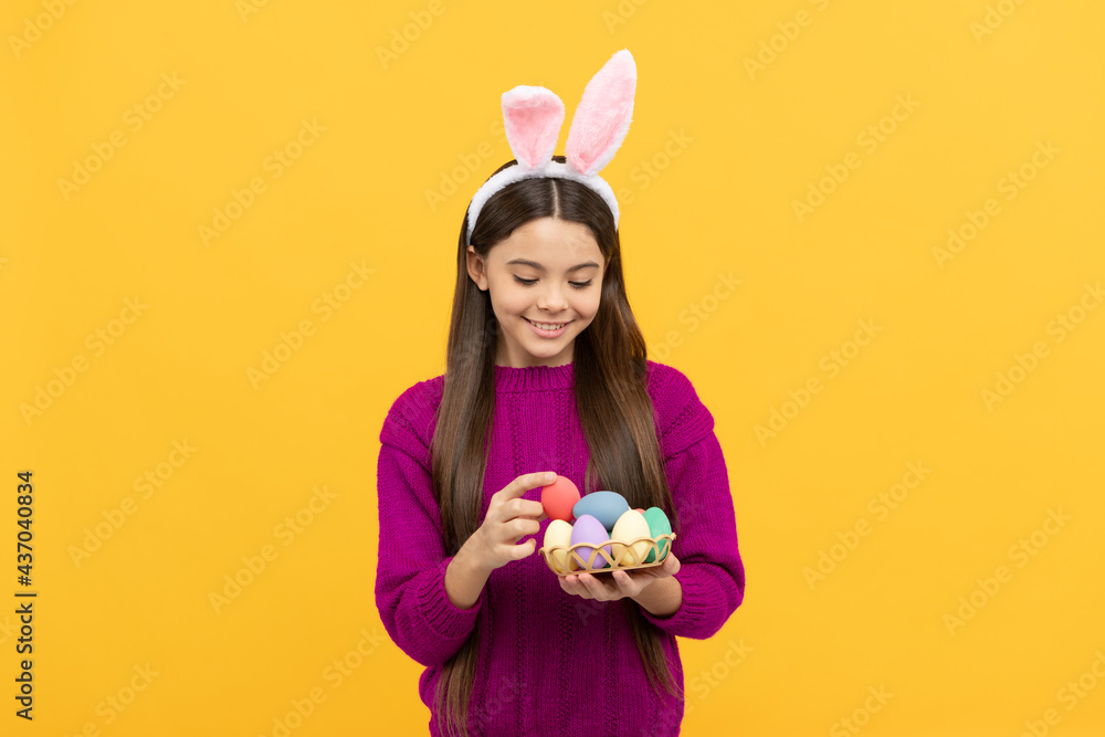 happy easter teen girl in funny bunny ears hold painted eggs, happy easter