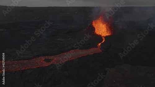 Fountain of magma erupting from explosive volcano crater, Iceland. Aerial photo
