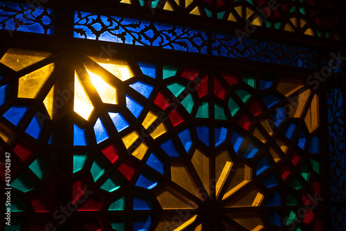 Photo of colored stained glass with colored light