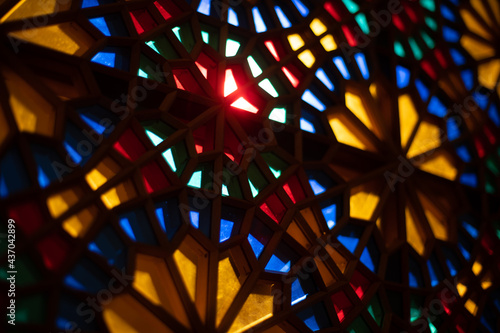 Photo of colored stained glass with colored light