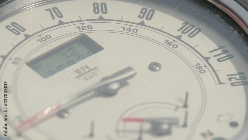 Shooter of the motorcycle speedometer moves, close-up. Arrow of the motorcycle speedometer changes position from speed increase. Shooter of the motorcycle speedometer moves, close-up. Arrow of the motorcycle speedometer changes position from speed increase.