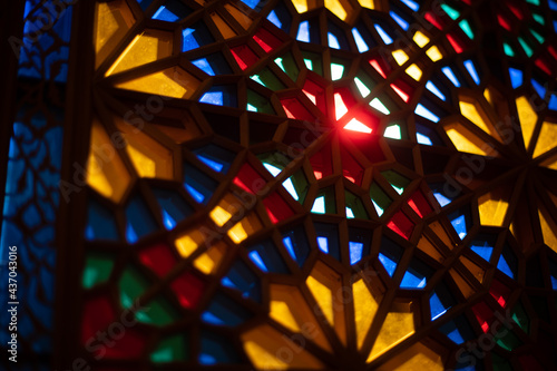 Photo of colored stained glass with colored light