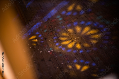 Photo of colored stained glass with colored light