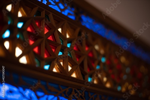 Photo of colored stained glass with colored light