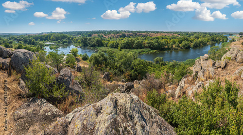 Summer Pivdennyi Buh  Southern Bug  river in Myhiya  Mykolayiv Region  Ukraine. Landscape of the river with rocky coast.