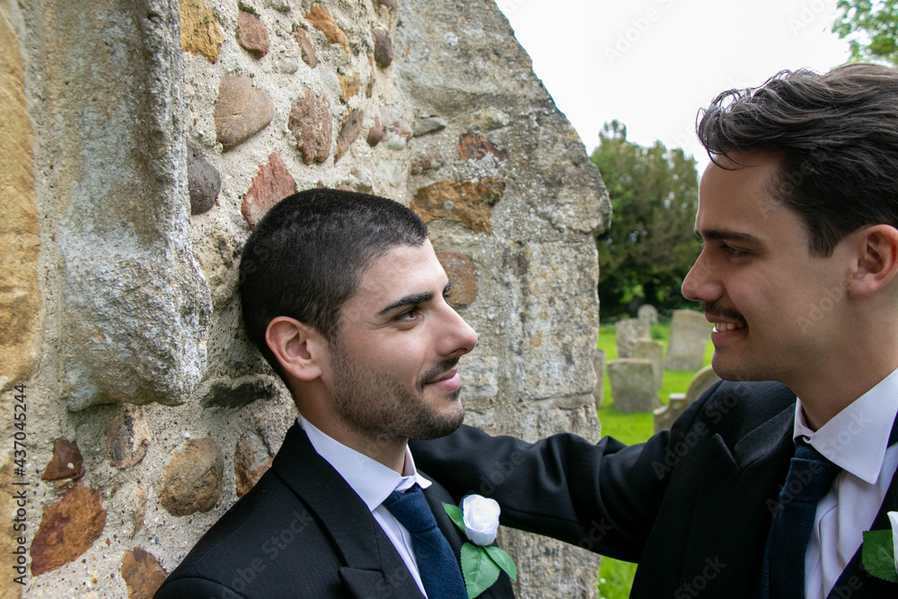 Gay husbands talking to each other outside of church Gay husbands talking to each other outside of church