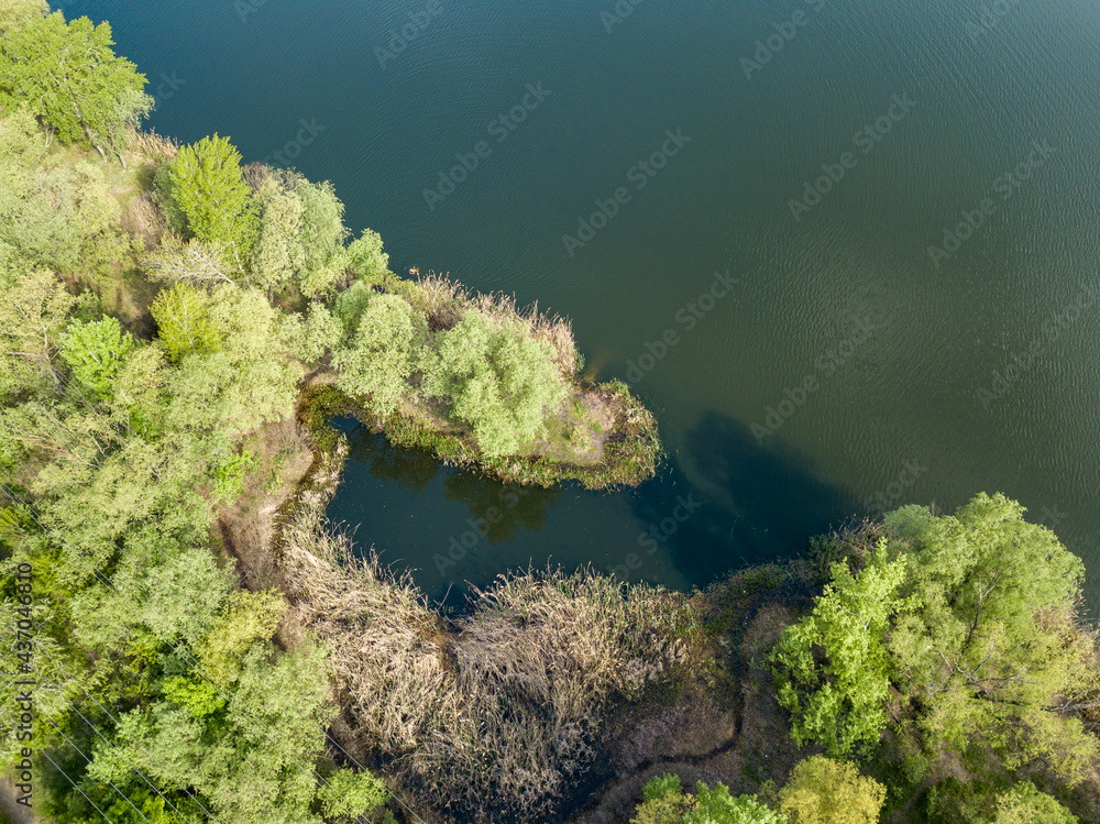 Lake in the park in spring. Aerial drone view. Lake in the park in spring. Aerial drone view.