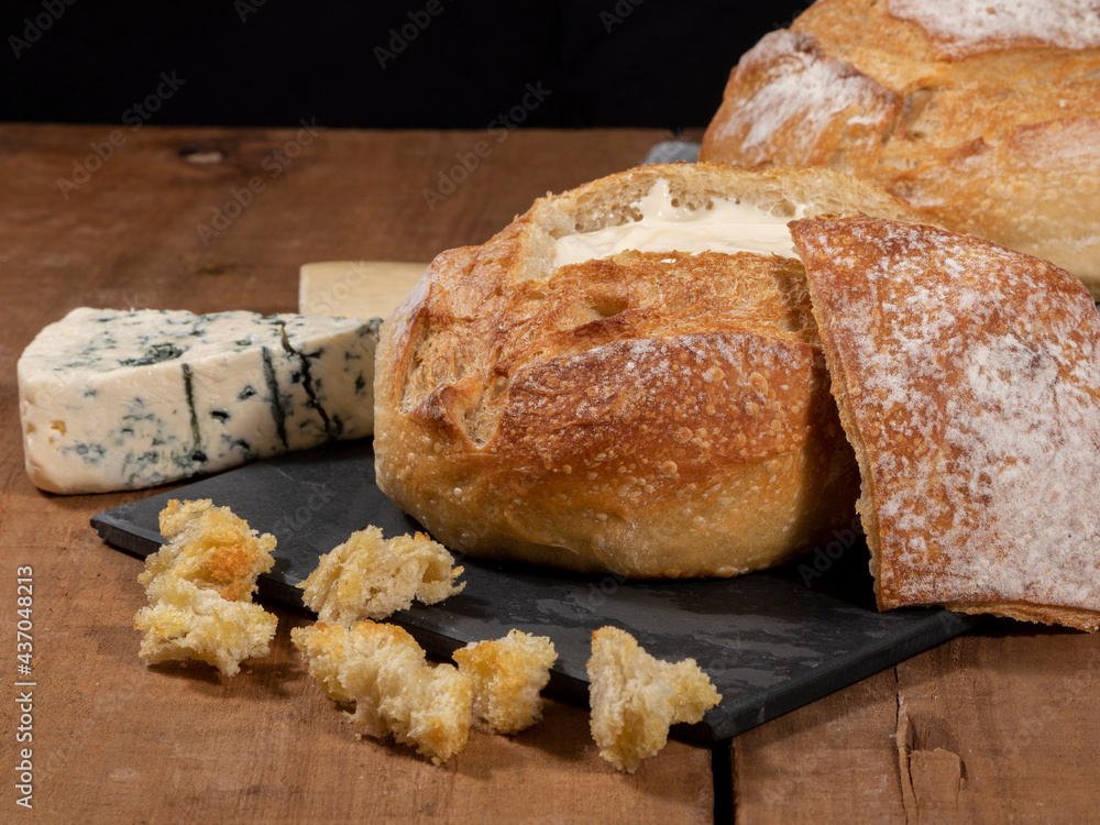 Cream cheese inside Italian bread with croutons, fondue.