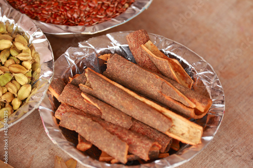 Spices and herbs in white bowls, spice in small spoon,food and cuisine ingredients,various spices collection,Food background,turmeric, star anise,mace,cloves photo