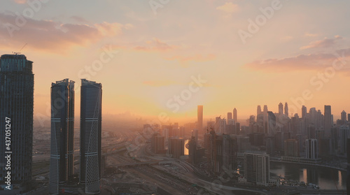 AERIAL. Top view of downtown Dubai at beautiful sunset, United Arab Emirates. photo