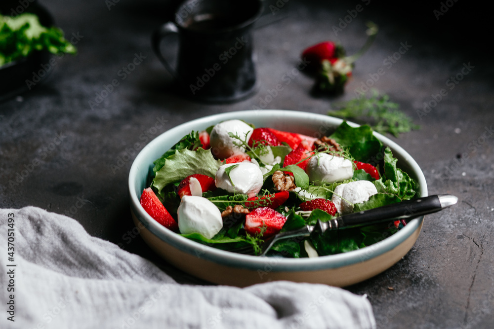 Salad with strawberries, mozzarella and arugula Salad with strawberries, mozzarella and arugula