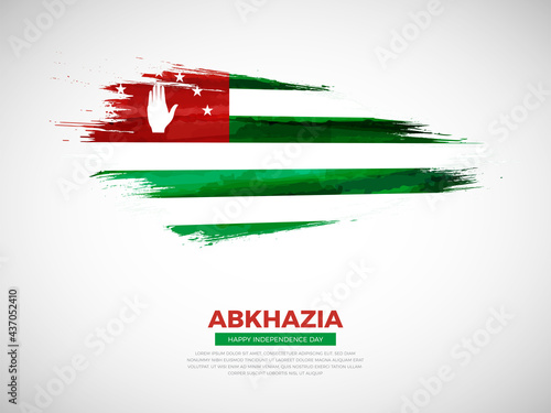 Grunge style brush painted Abkhazia country flag illustration with Independence day typography