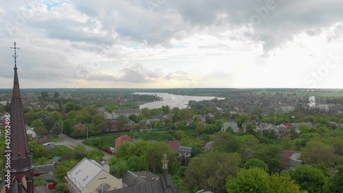 Flying over the church flock of birds Exaltation of the Holy Cross church Fastiv Ukraine aerial drone view photo